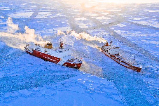 The US Coast Guard cutter Healy approaches a tanker ship stranded in ice.